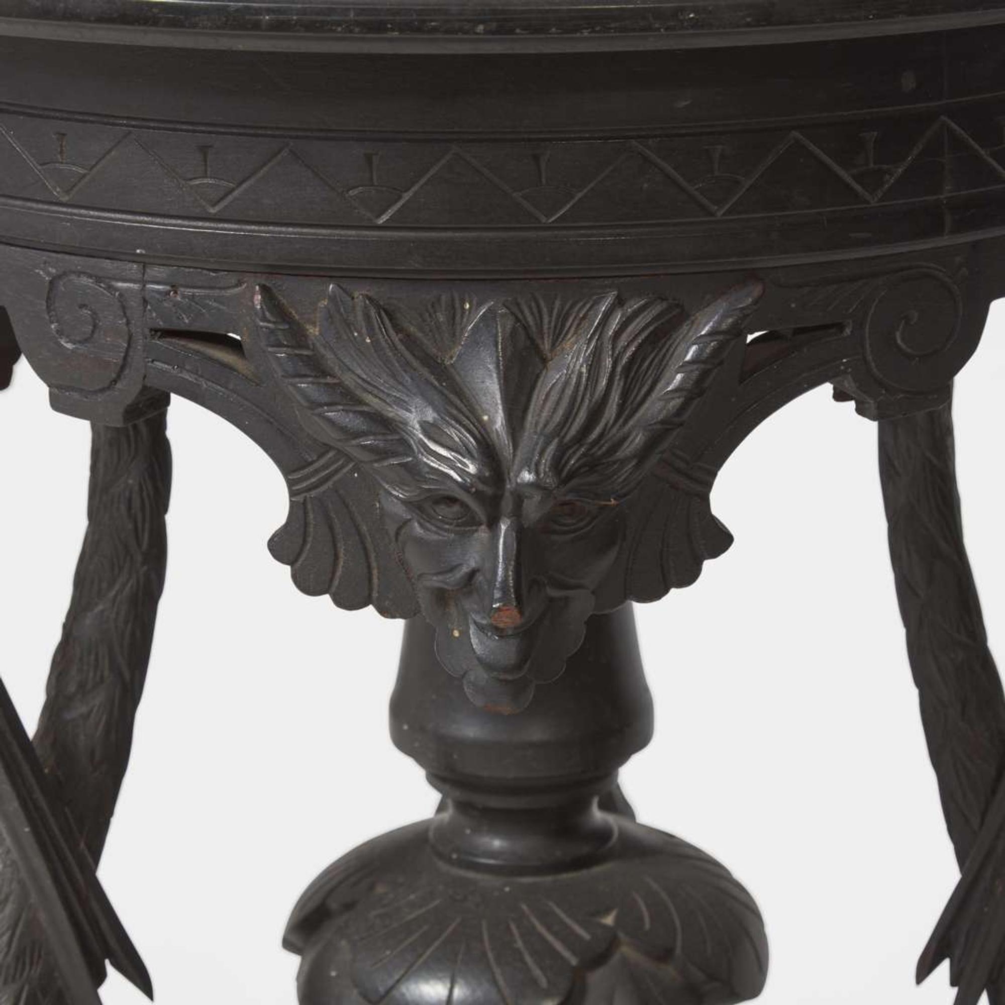 An Aesthetic Movement carved and ebonized wood pedestal with cranes late 19th century