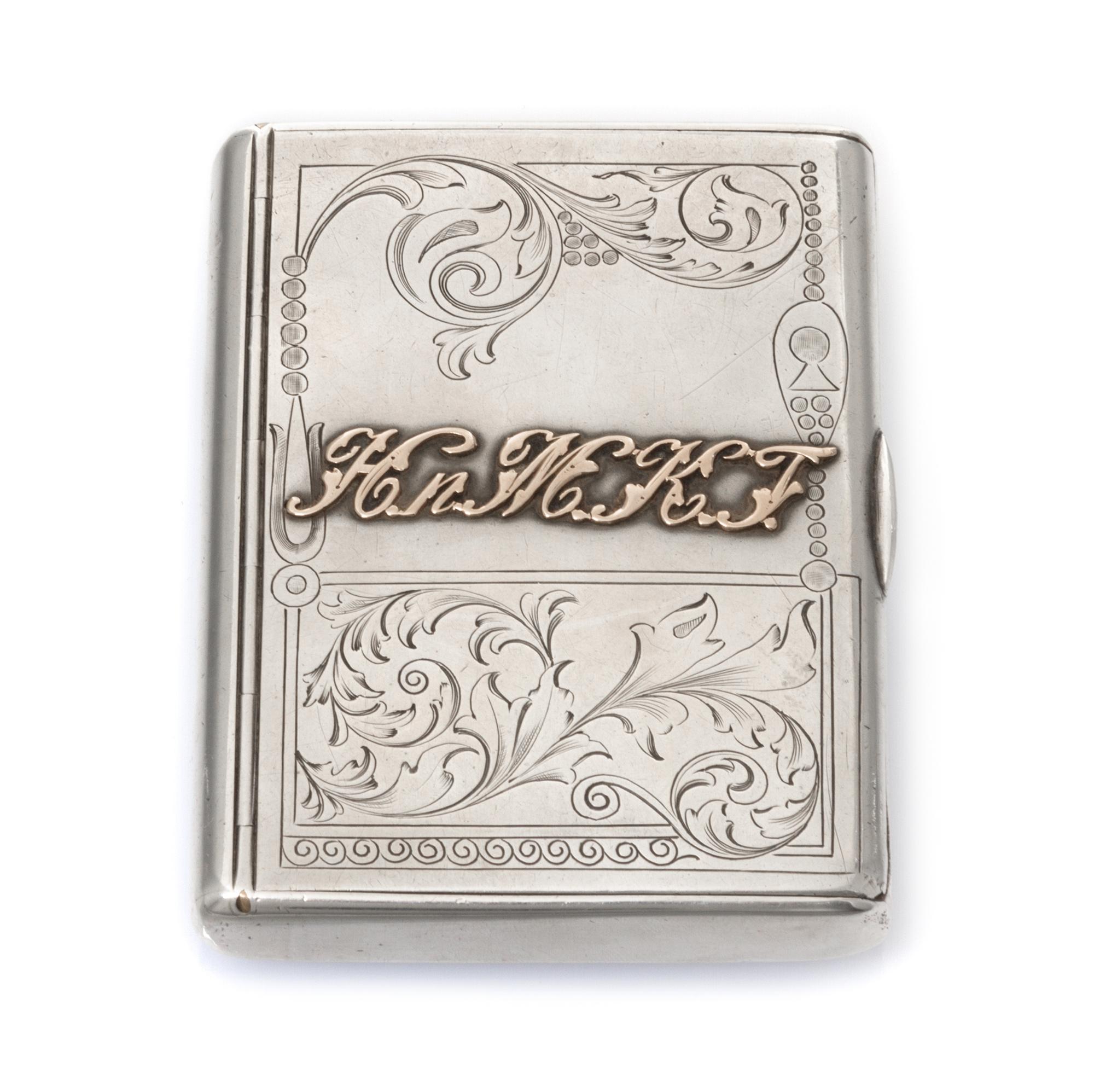 A Russian Silver Cigarette Case, Mark of I.P. Khlebnikov with Imperial warrant, Moscow, late 19th/early 20th century, the lid with an a