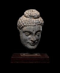 A Gandharan Grey Schist Buddha Head