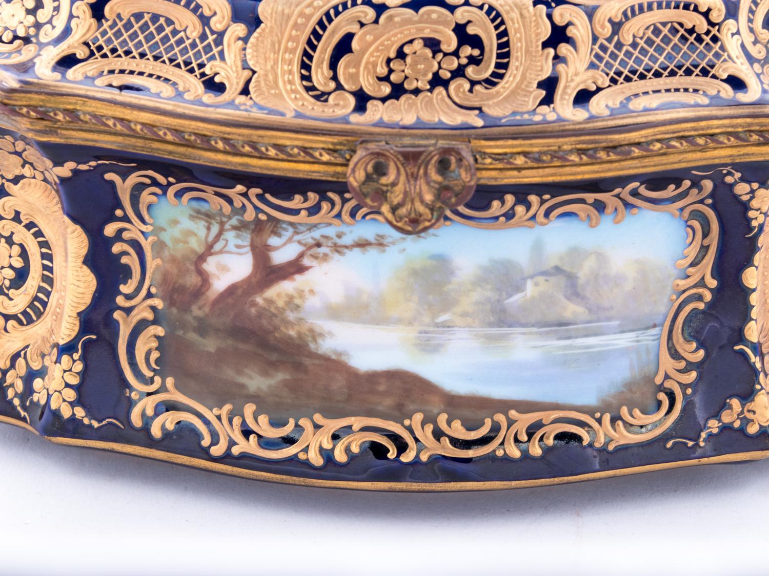 A Sèvres Style Painted and Parcel Gilt Porcelain Table Casket