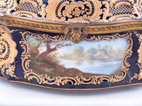 A Sèvres Style Painted and Parcel Gilt Porcelain Table Casket