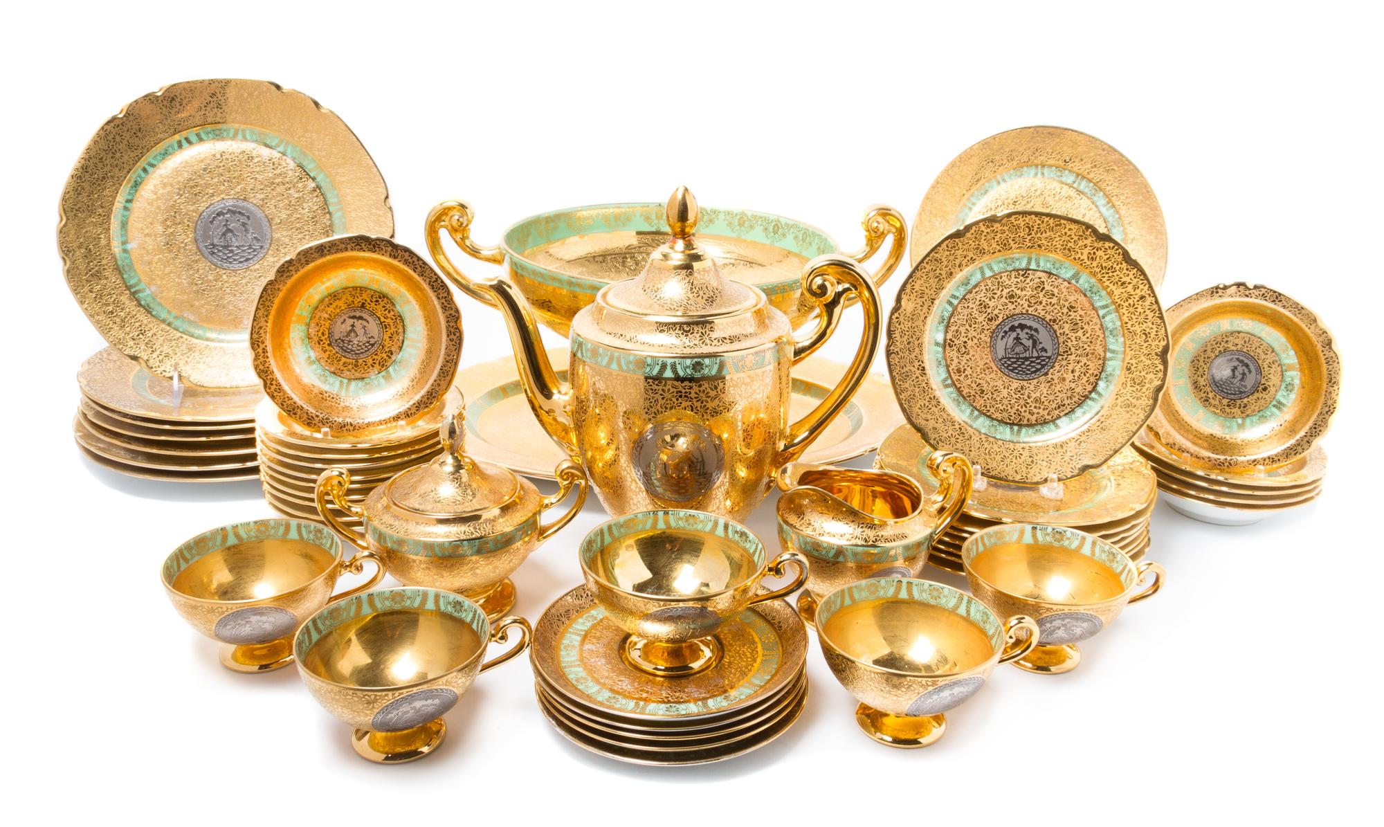 A Czech Porcelain Dinner Service Height of coffee pot 10 inches.