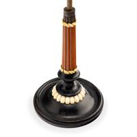 An Austrian Carved and Parcel-Ebonized Columnar Adjustable Quill Stand
