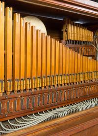 A Marquette Cremona Style K Oak and Stained Glass Orchestrion, CIRCA 1915, SERIAL NO. 11527, Height 66 x width 64 1/2 x depth 31 1/4 in — CIRCA 1915, SERIAL NO. 11527,