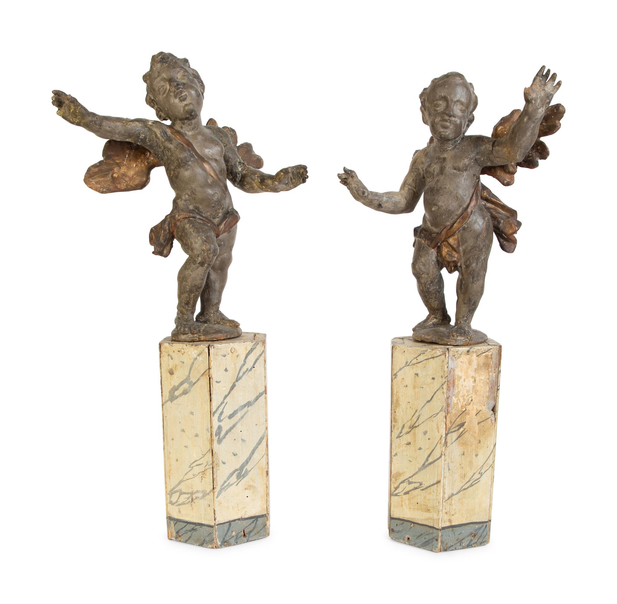 A Pair of Italian Carved Putti on Painted Faux-Marble Bases — 17TH/18TH CENTURY