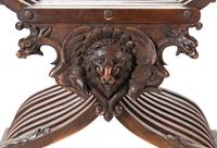A Renaissance Revival Carved Walnut Savonarola Chair
