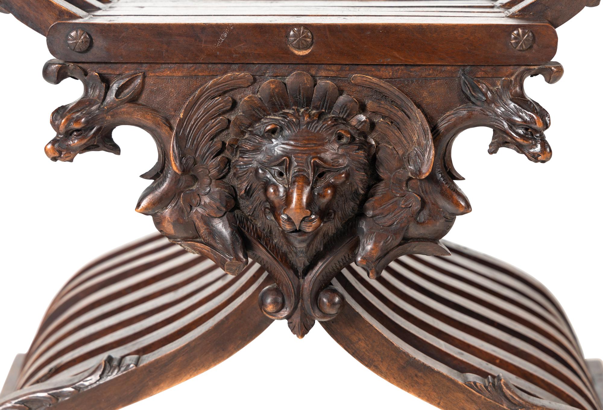 A Renaissance Revival Carved Walnut Savonarola Chair
