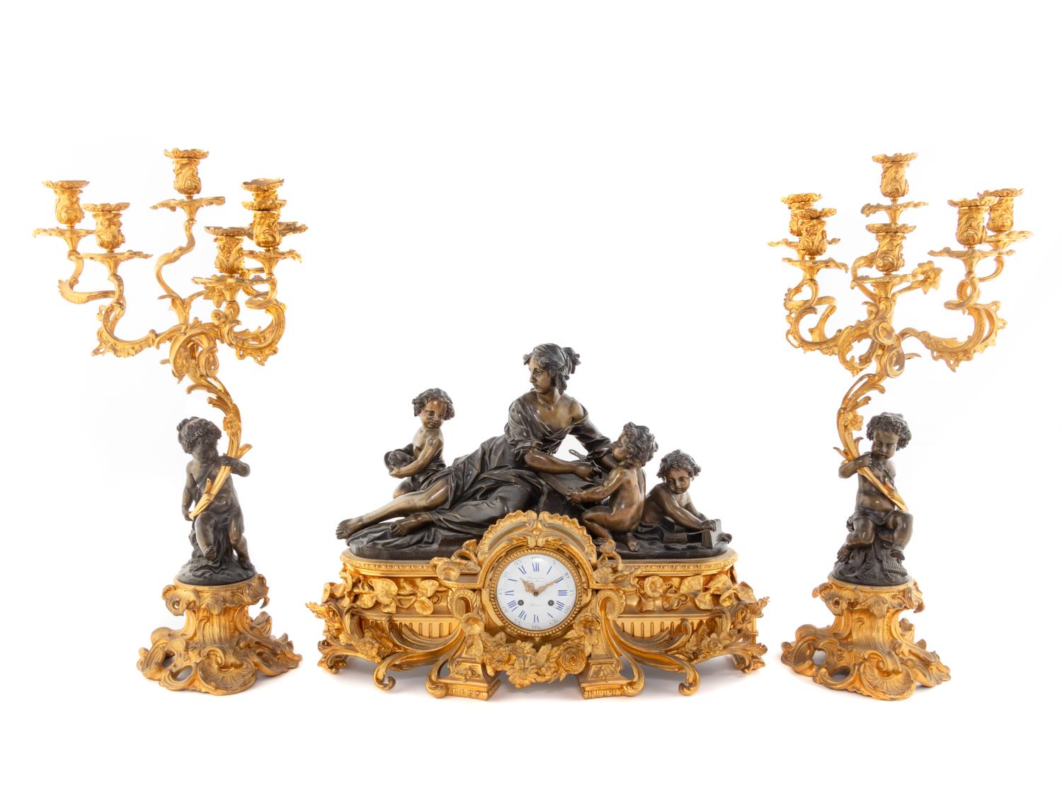 A French Gilt and Patinated Bronze Clock Garniture