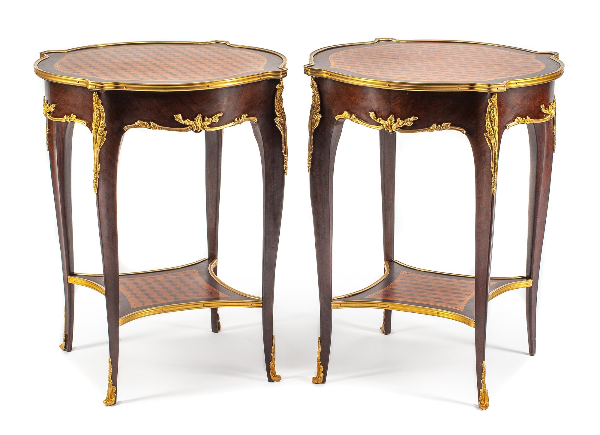 A Pair of Louis XV Style Gilt Bronze Mounted Parquetry Tables Height 28 x diameter of top 23 inches.