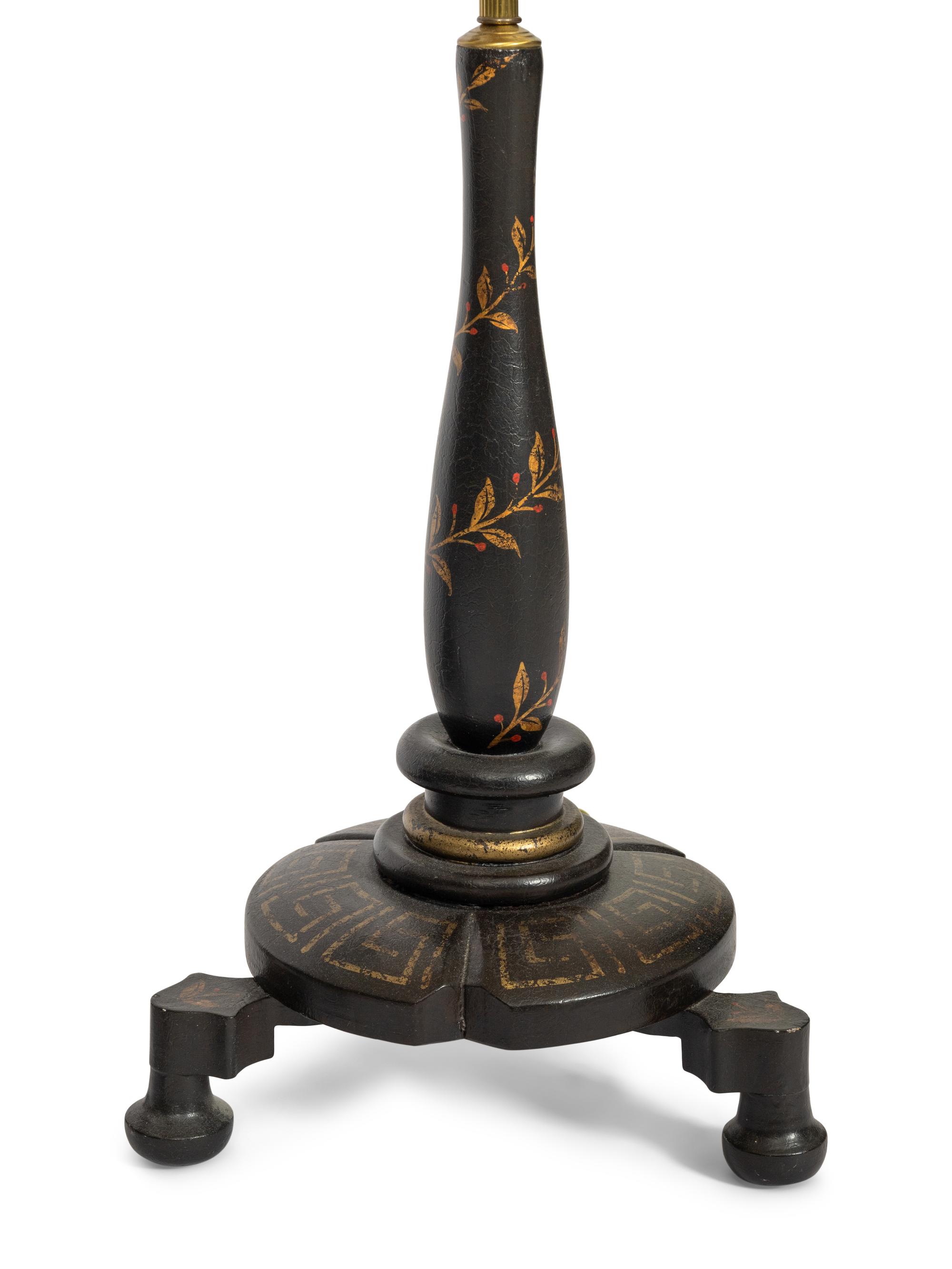 A Pair of Ebonized Parcel Gilt Floor Lamps with Papier Mache Shades