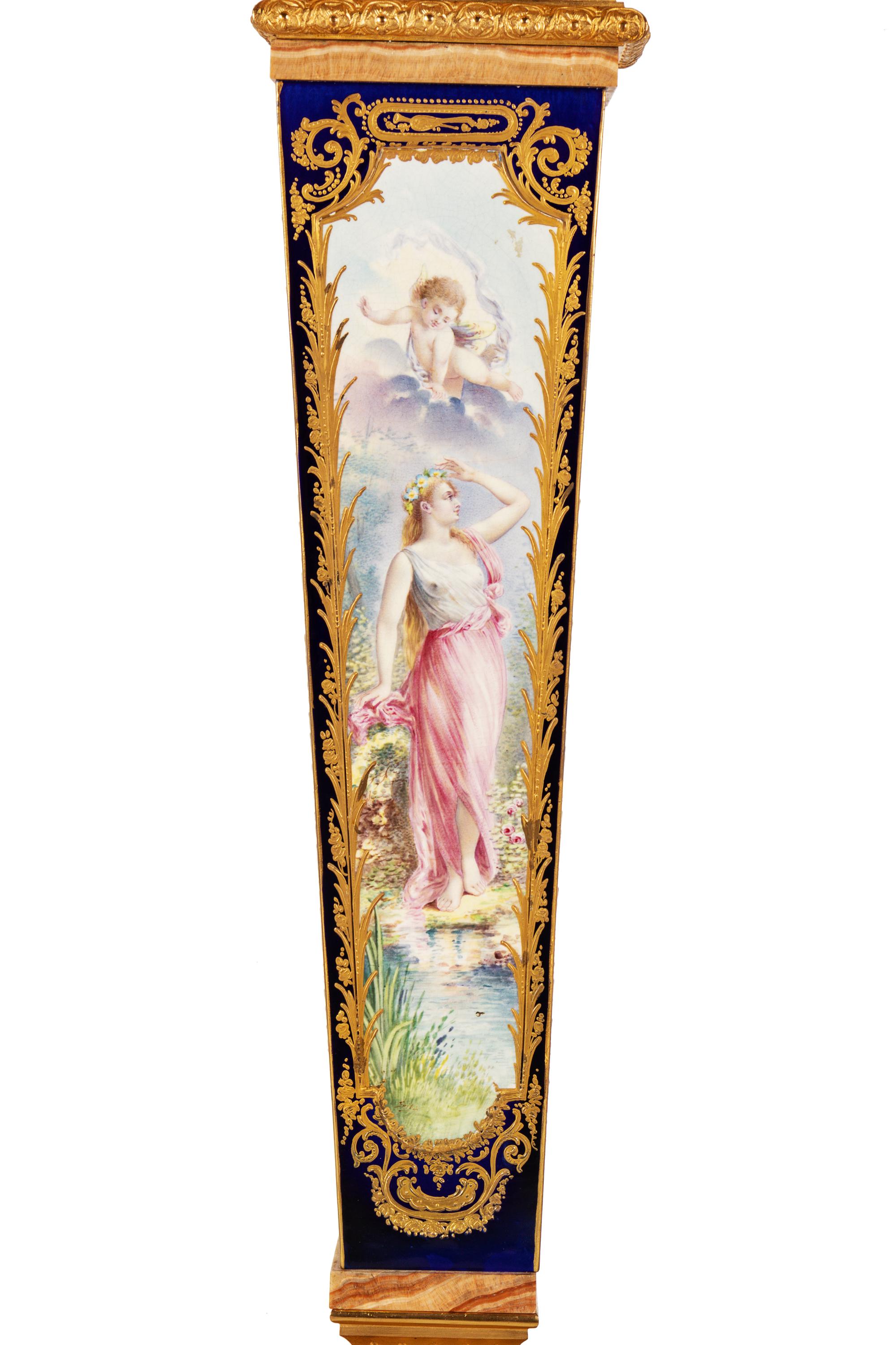 A Pair of Sèvres Style Gilt Bronze Mounted Painted and Parcel Gilt Porcelain and Onyx Pedestals