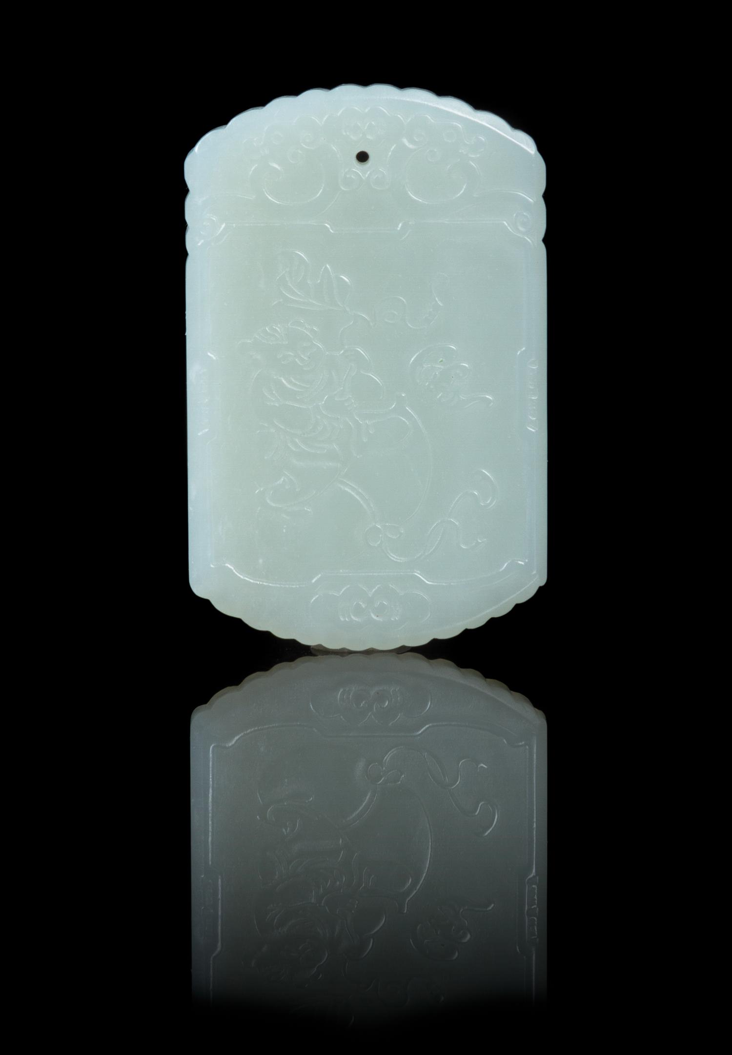 A Carved Pale Celadon Jade Plaque Height 2 1/8 inches.