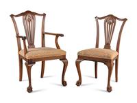 A Set of Seven George III Style Walnut Dining Chairs