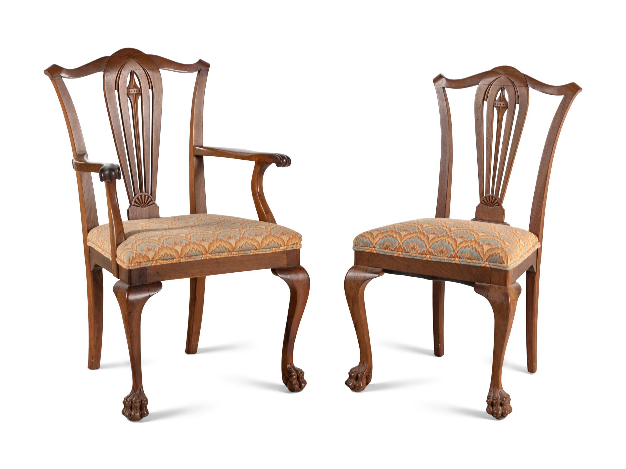A Set of Seven George III Style Walnut Dining Chairs