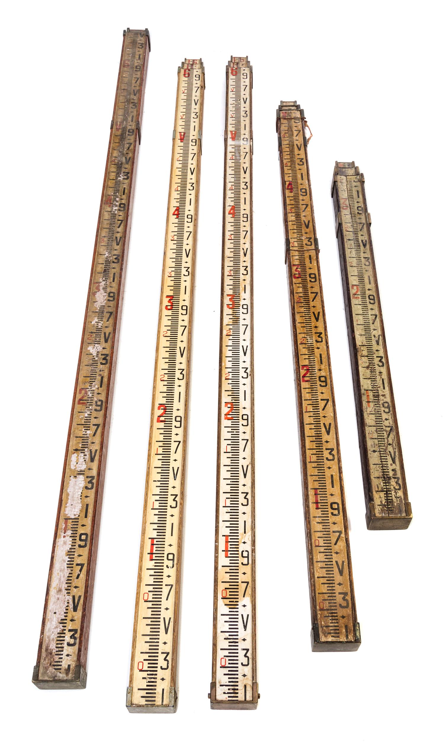 A Group of Five Surveyor's Telescoping Level Rods Height of tallest 80 inches (when collapsed).
