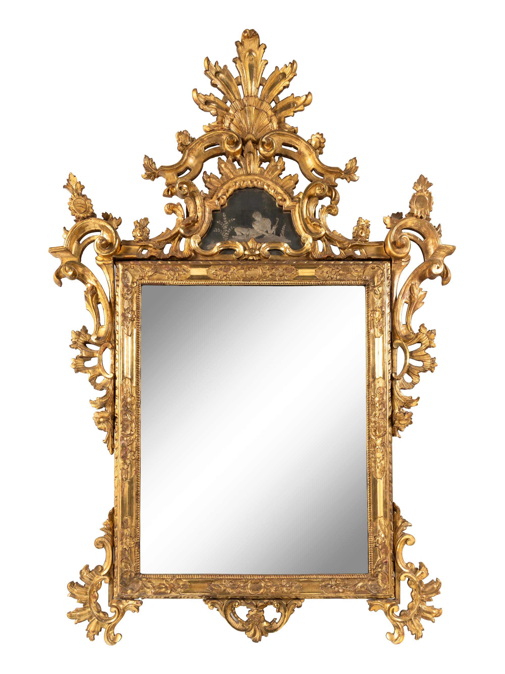 An Italian Baroque Style Giltwood and Etched Glass Mirror