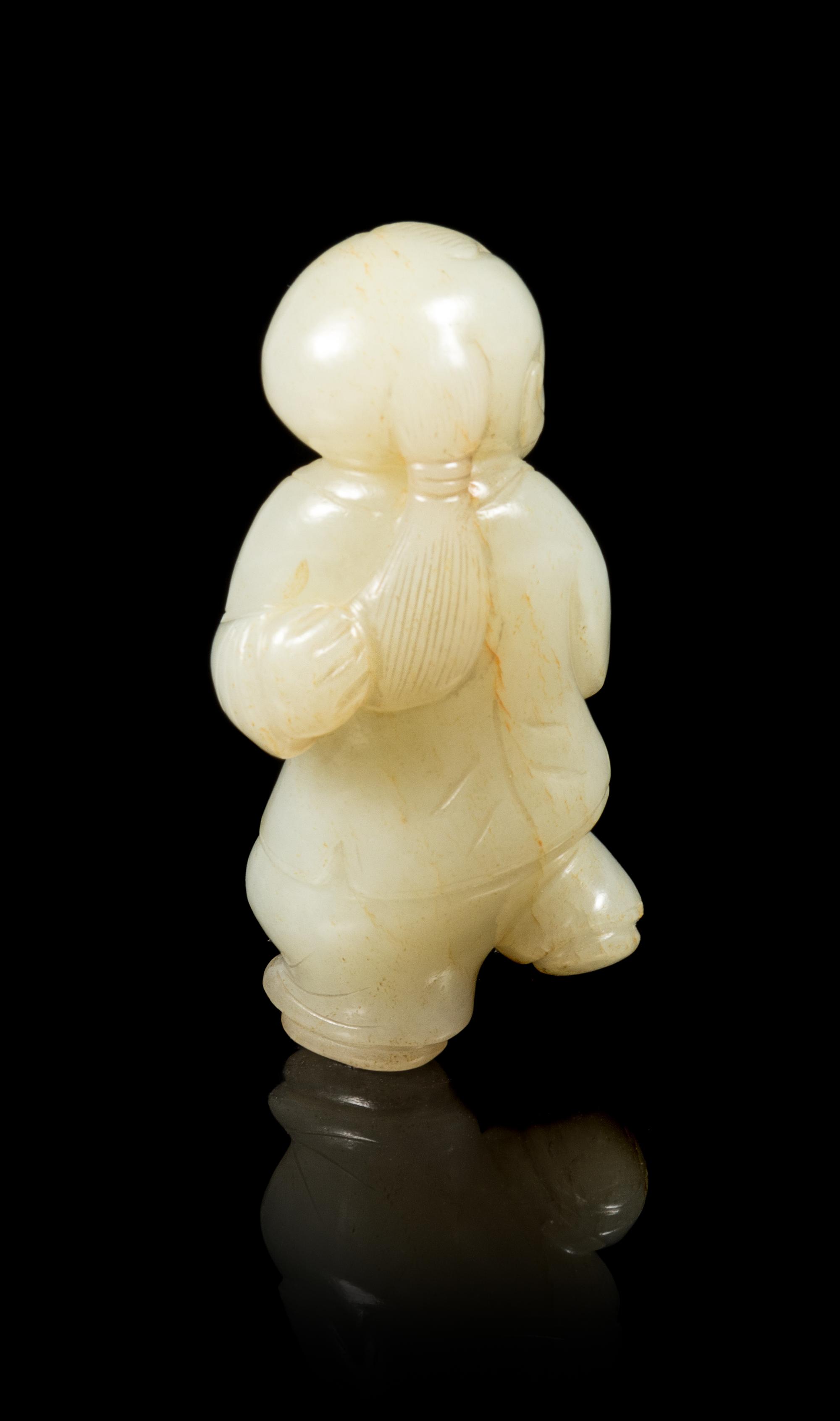 A Celadon Jade Figure of a Boy Height 2 7/8 inches. — 18TH/19TH CENTURY
