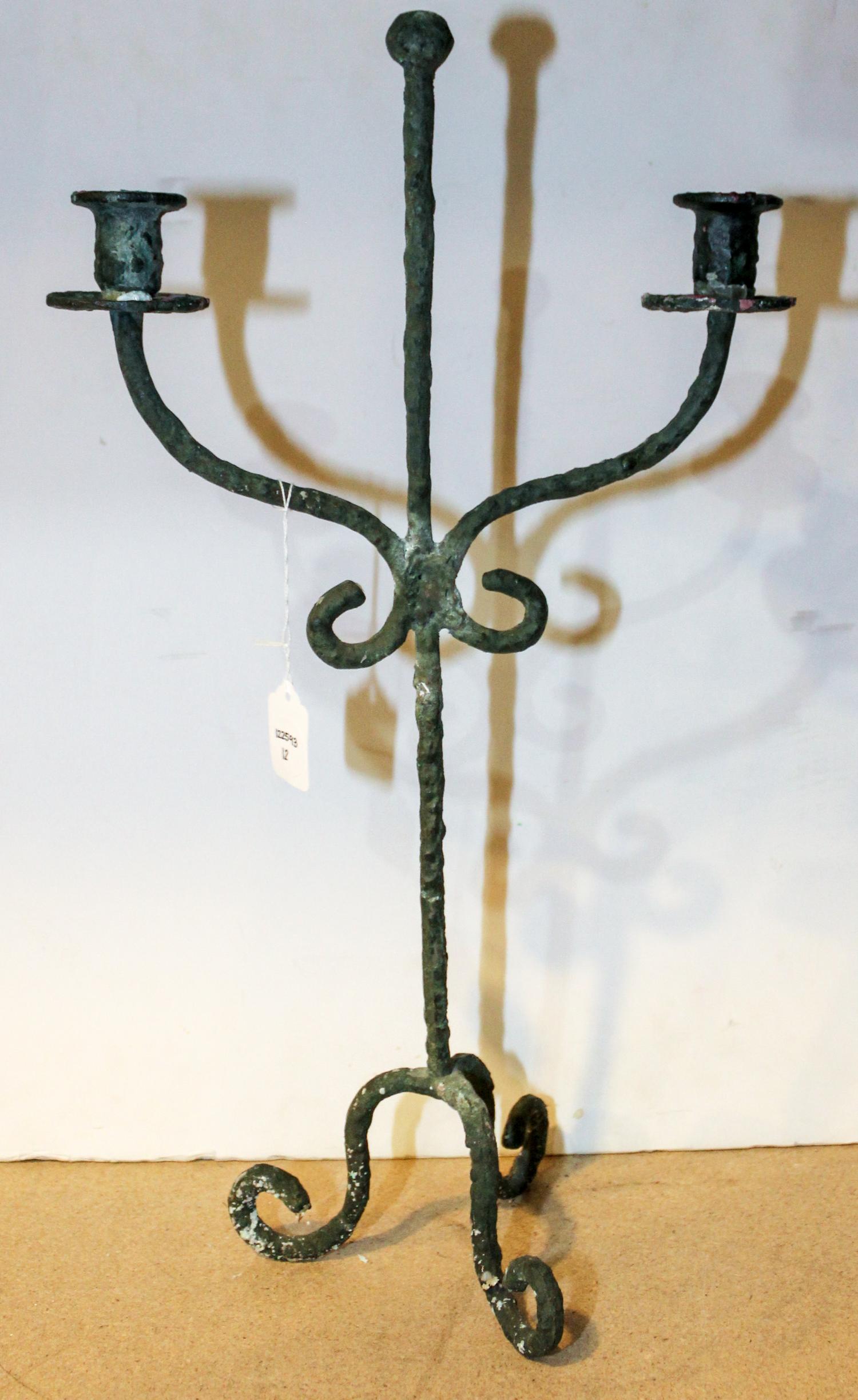 A Giacometti Style Candelabra Height 21 inches.