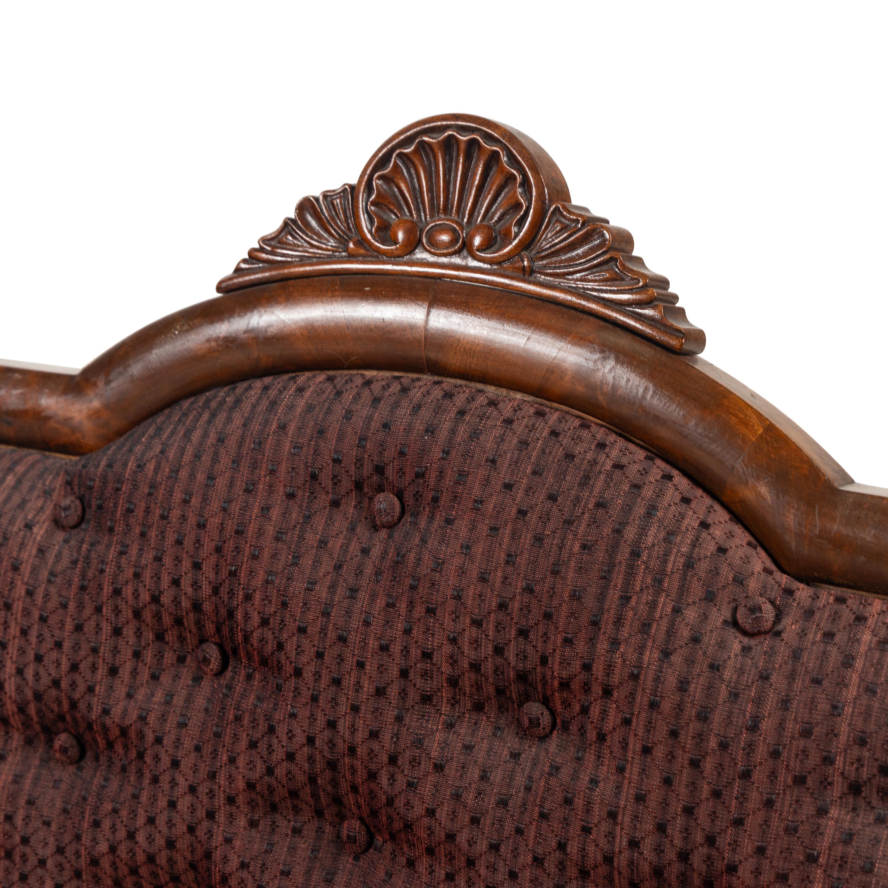 A Pair of Classical Veneered Mahogany and Upholstered Settees