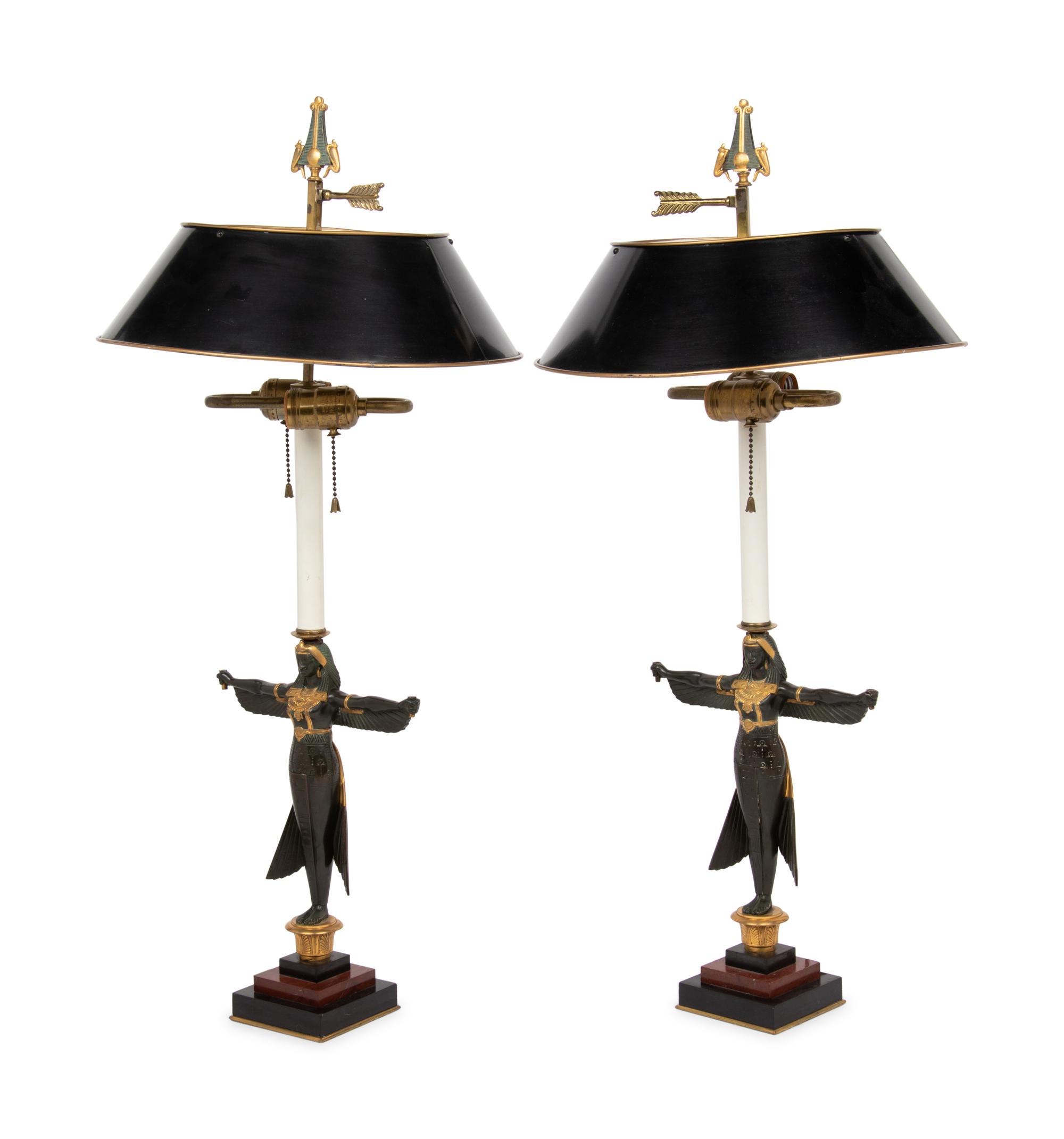 A Pair of Egyptian Revival Parcel Gilt Bronze Figures Mounted as Lamps with Tole Shades