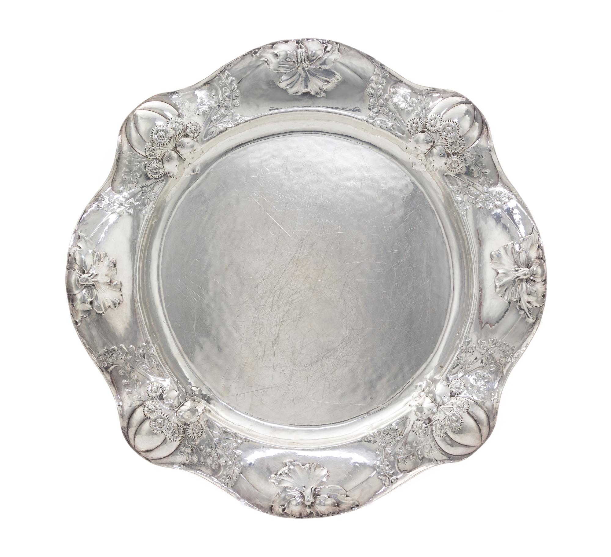 An American Silver Martele Entree Dish, Gorham Mfg. Co., Providence, RI, 1908, shaped circular, the undulating border chased with gourd