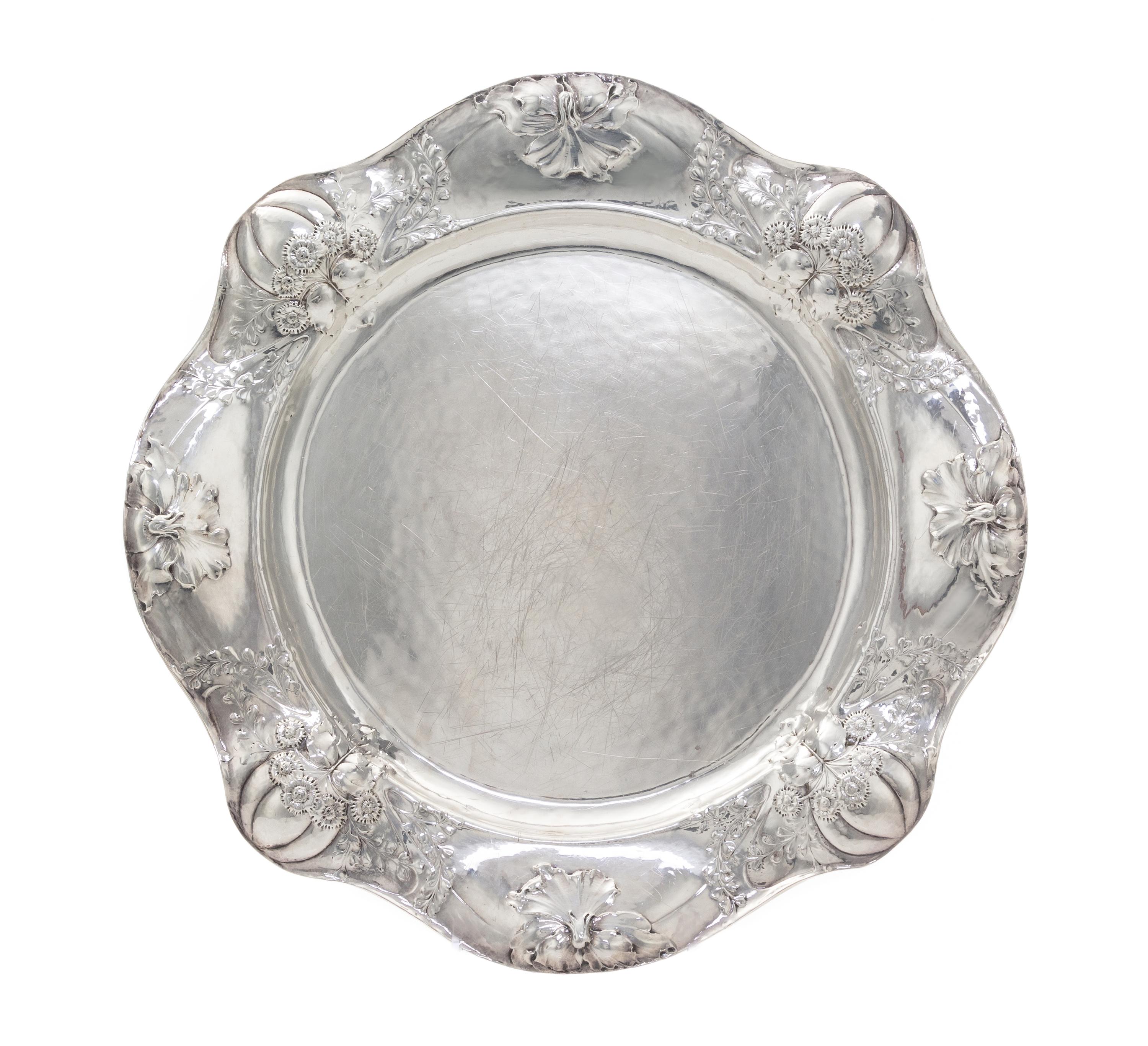 An American Silver Martele Entree Dish, Gorham Mfg. Co., Providence, RI, 1908, shaped circular, the undulating border chased with gourd