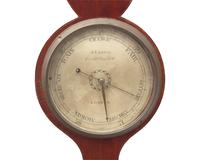 A Regency Inlaid Mahogany Wheel Barometer