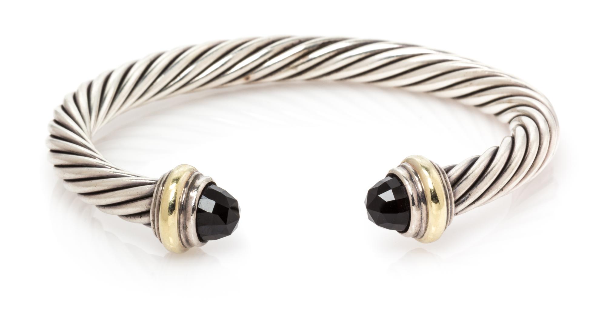 A Sterling Silver, 14 Karat Yellow Gold and Onyx 'Cable Classics' Bracelet, David Yurman, 26.75 dwts.