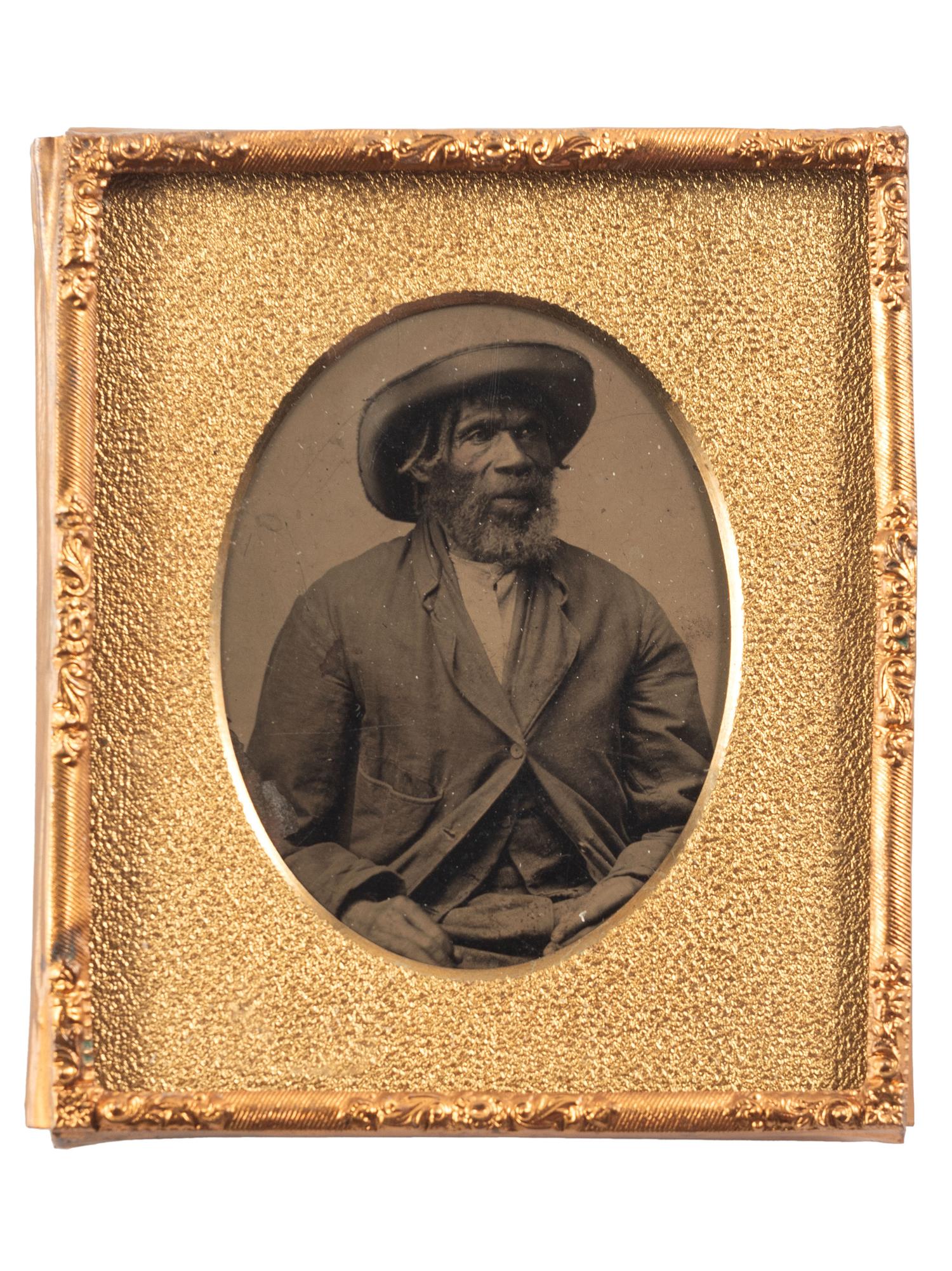 [EARLY PHOTOGRAPHY]. Sixth plate tintype portrait of a Black man wearing a large hat.