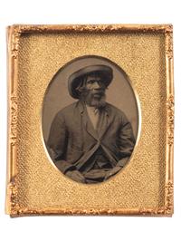 [EARLY PHOTOGRAPHY]. Sixth plate tintype portrait of a Black man wearing a large hat.
