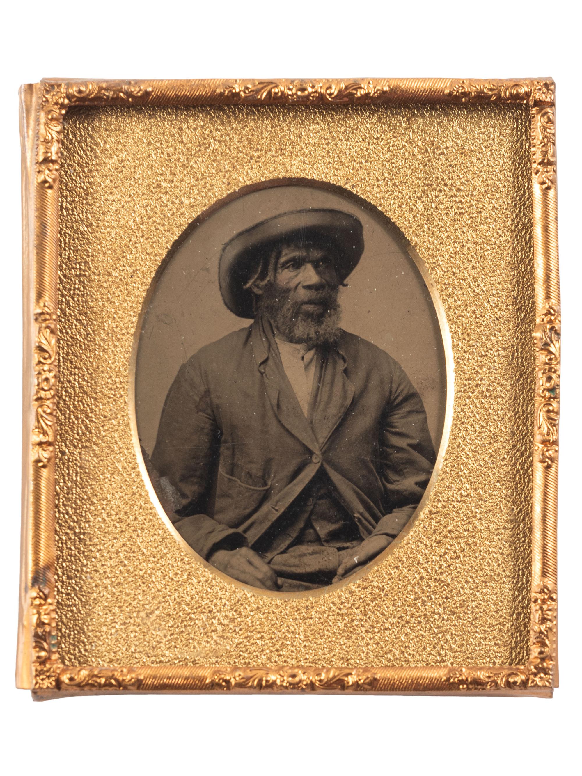 [EARLY PHOTOGRAPHY]. Sixth plate tintype portrait of a Black man wearing a large hat.