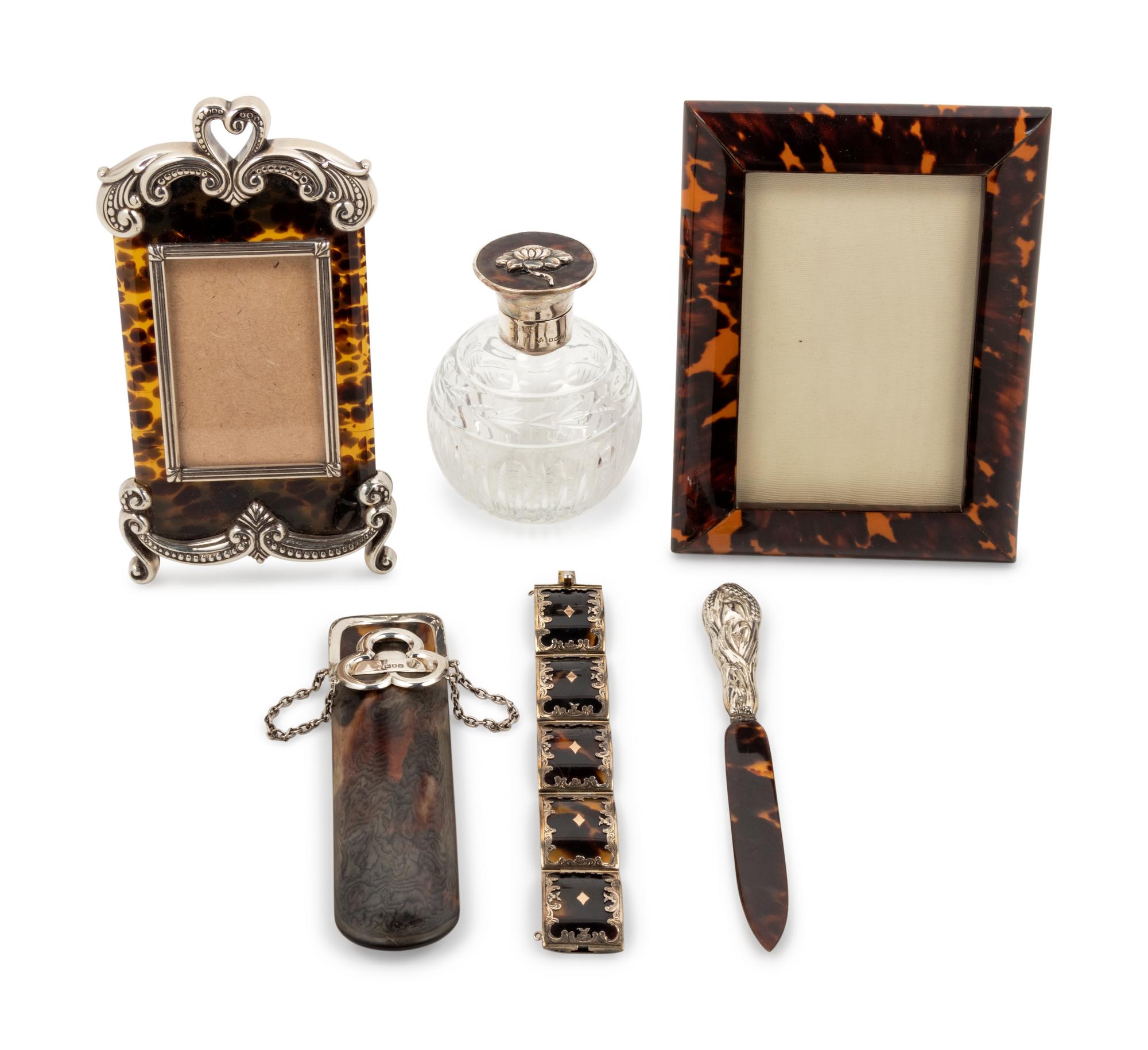A Group of Silver-Mounted Tortoise Shell Table Articles