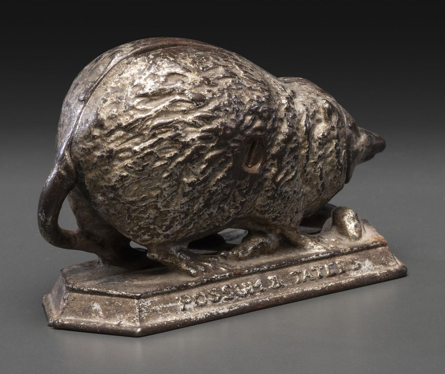 A 'Billy Possum' Cast Iron Still Bank