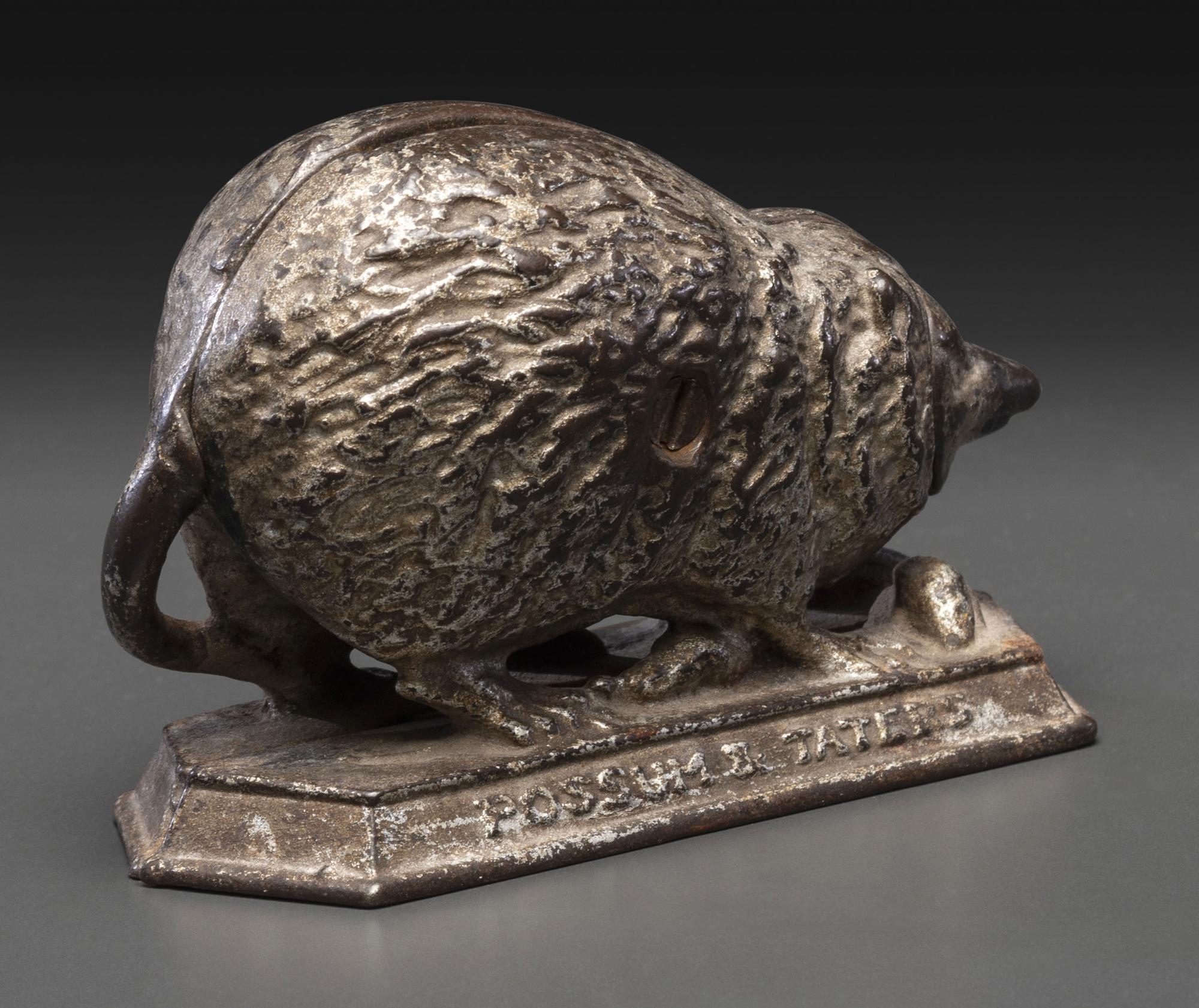 A 'Billy Possum' Cast Iron Still Bank