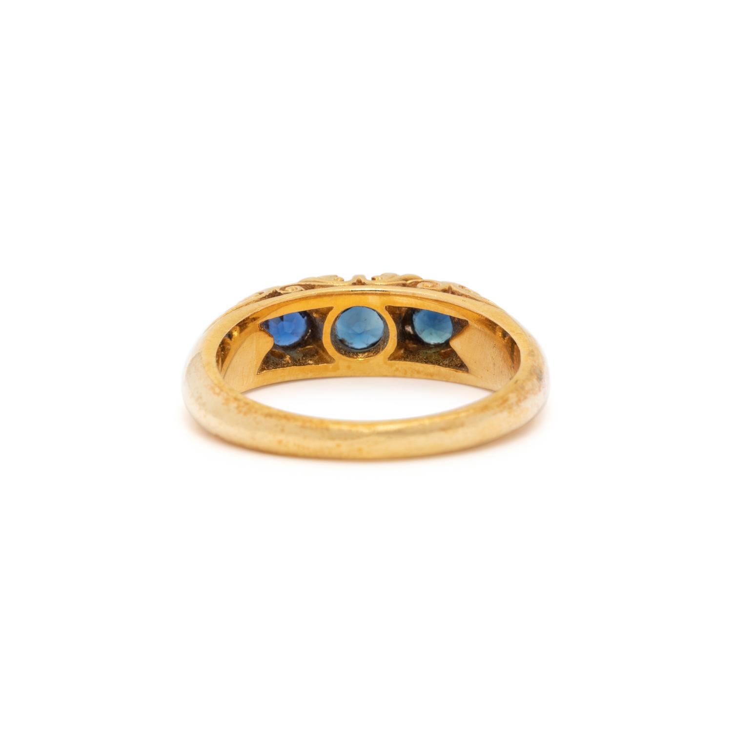 YELLOW GOLD, SYNTHETIC SAPPHIRE AND DIAMOND RING