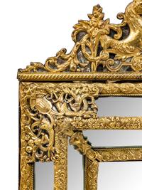 A Brass Embossed Venetian Style Mirror