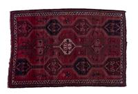 A Persian Wool Rug 5 feet 5 1/2 inches x 7 feet 10 3/4 inches.