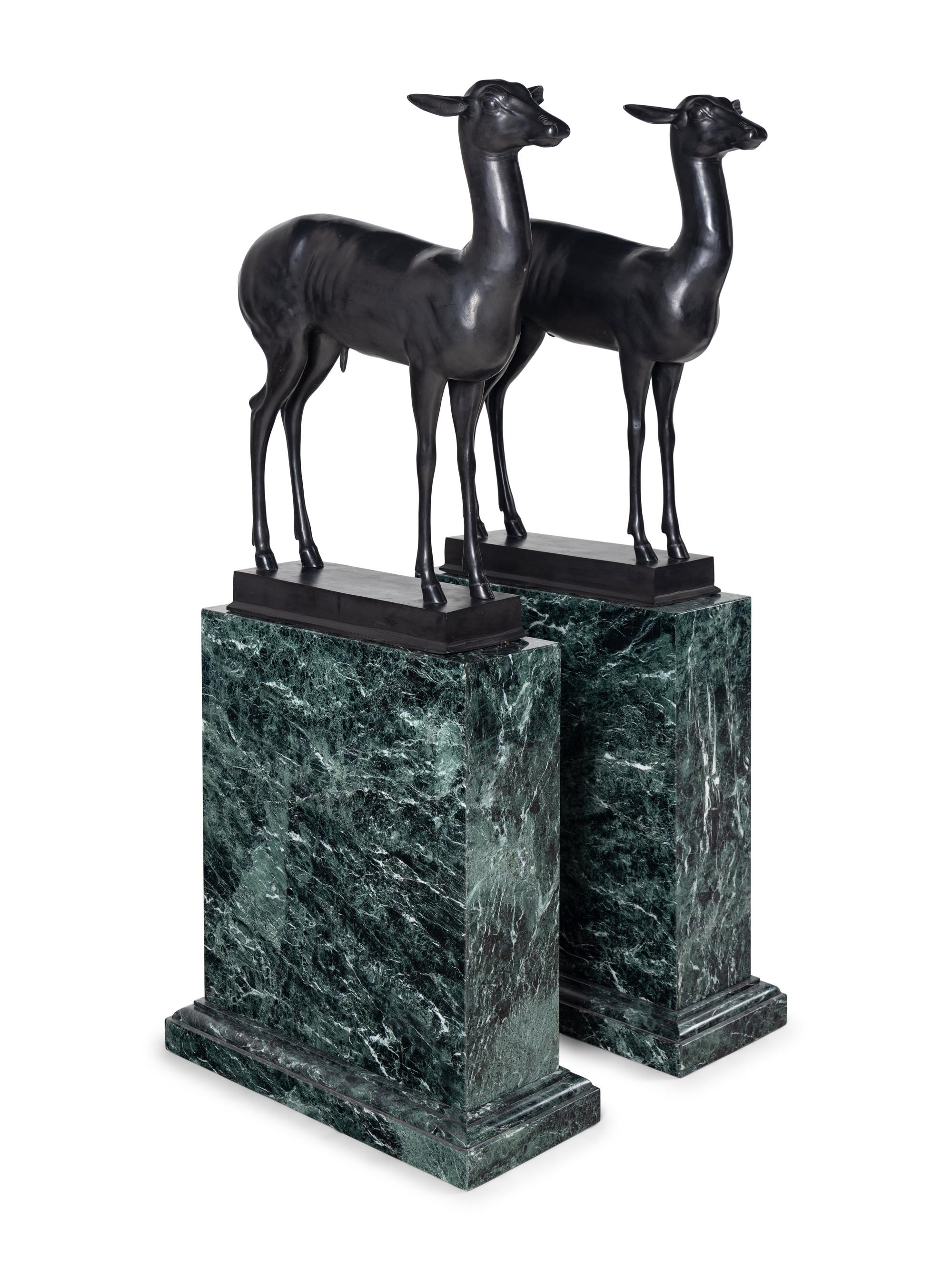 A Pair of Bronze Models of Pompeiian Deer on Marble Plinths