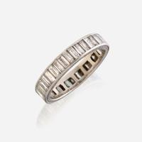 A diamond and fourteen karat white gold eternity band