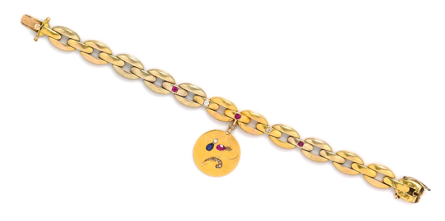 A Vintage 14 Karat Yellow Gold Diamond, Sapphire and Ruby Bracelet with Charm, 11.60 dwts.