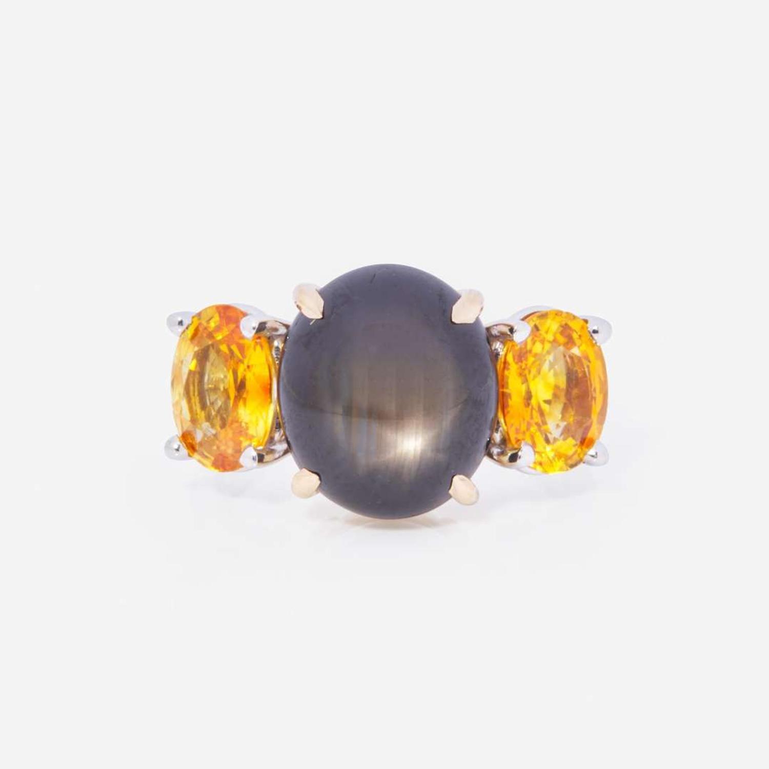 A Black Star Sapphire and Yellow Sapphire Ring