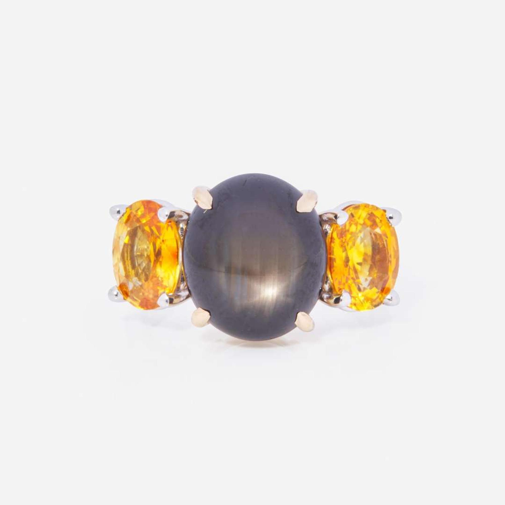 A Black Star Sapphire and Yellow Sapphire Ring