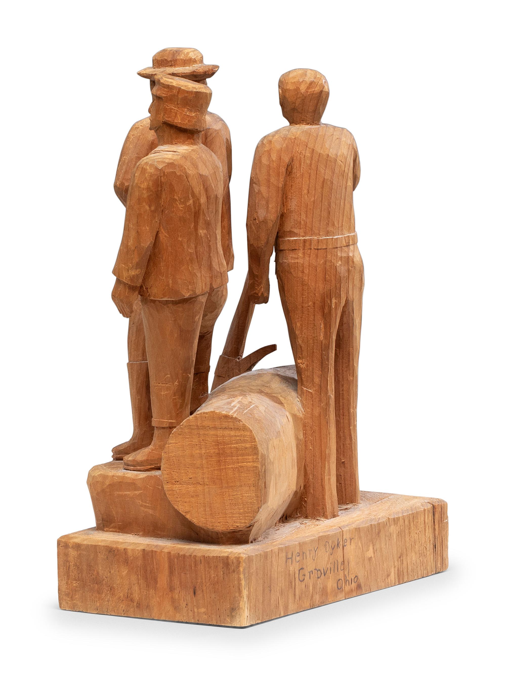 A Folk Art Carved Pine Group of Lumberjacks