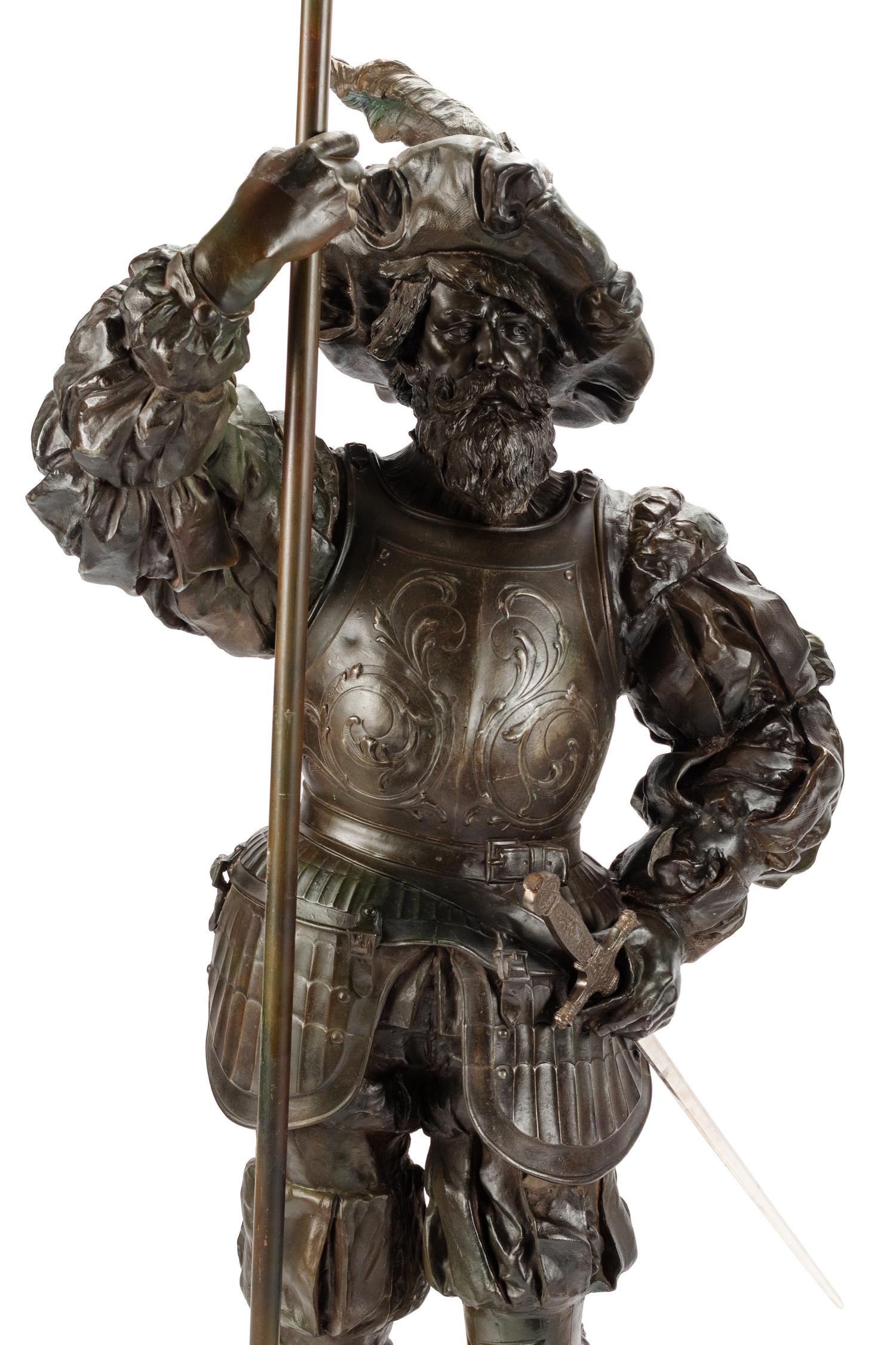A Pair of Cast Metal Figural Torchères