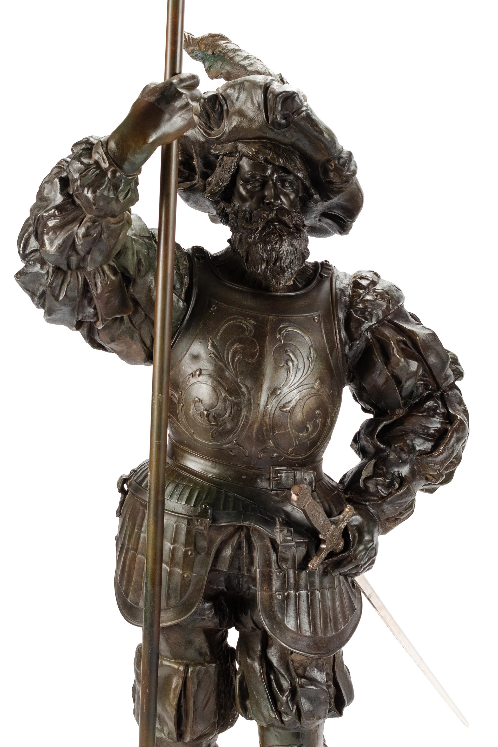 A Pair of Cast Metal Figural Torchères