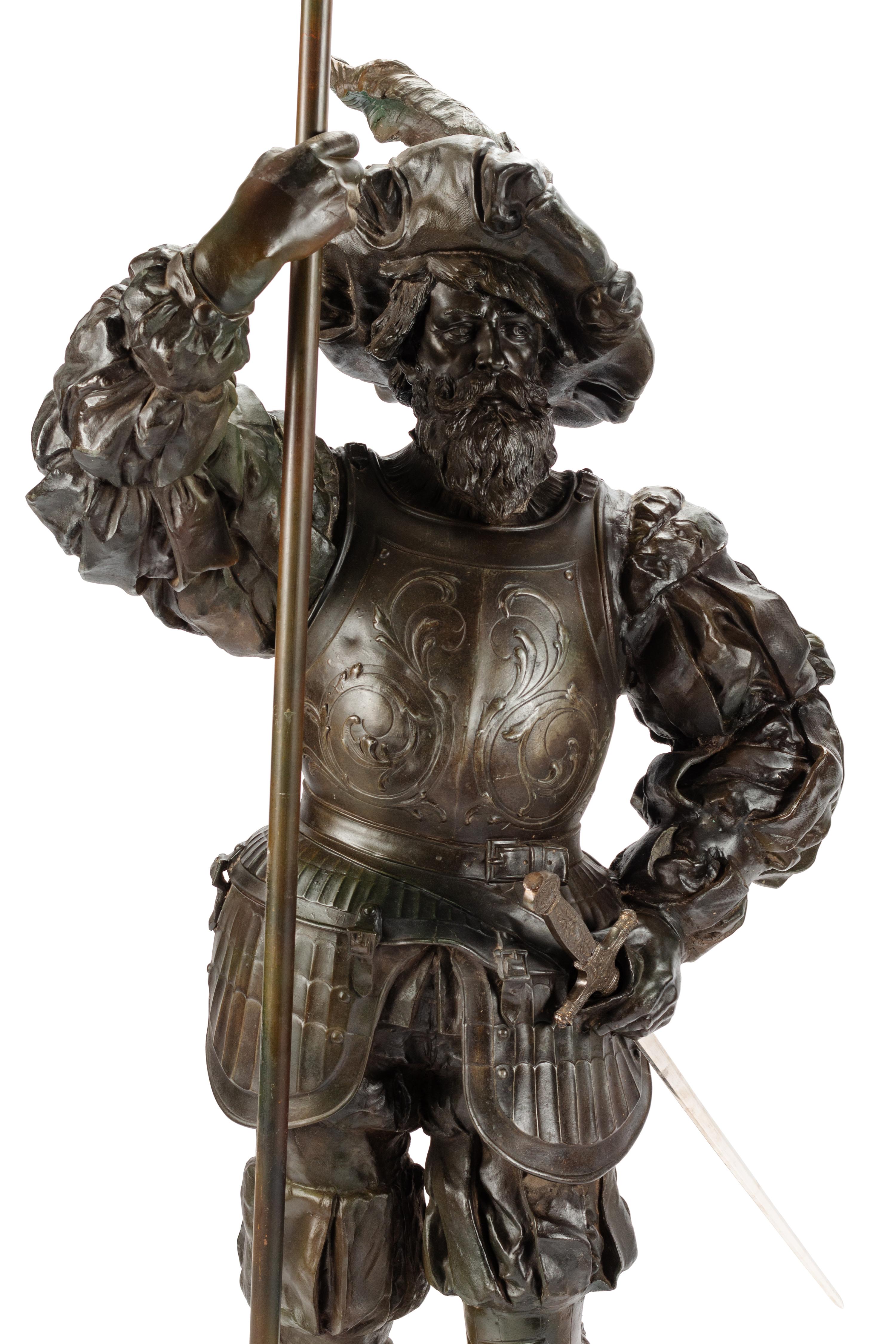 A Pair of Cast Metal Figural Torchères
