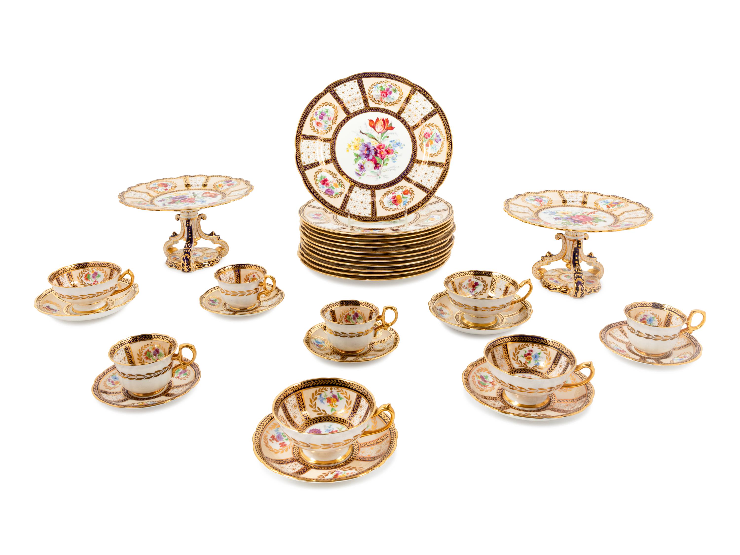 A Continental Parcel-Gilt and Polychrome Porcelain Dinner Service
