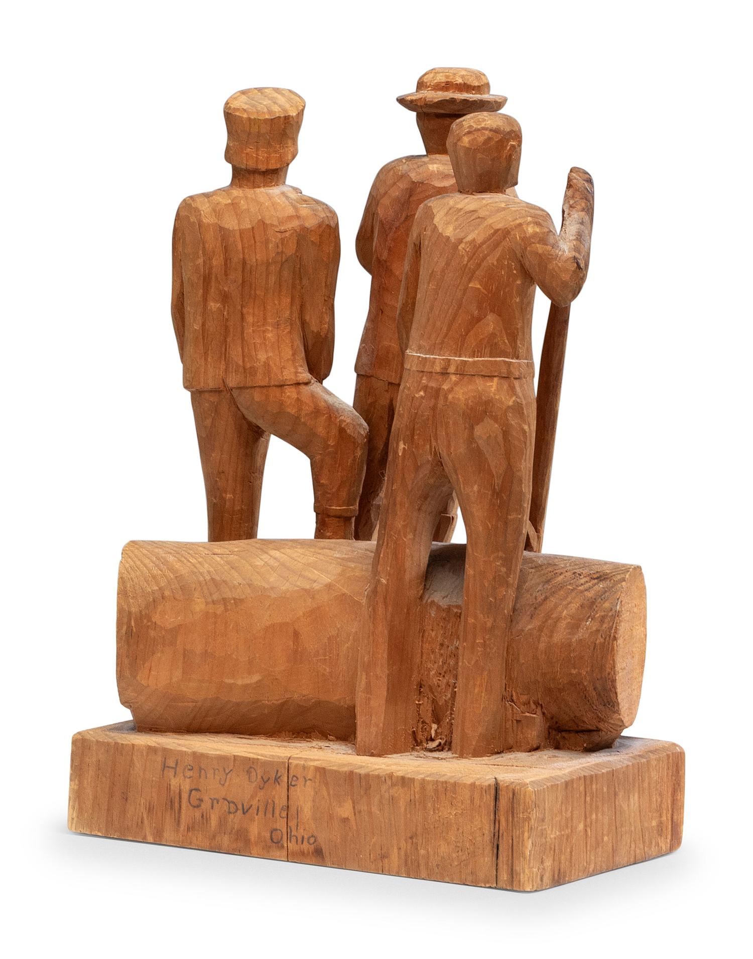 A Folk Art Carved Pine Group of Lumberjacks