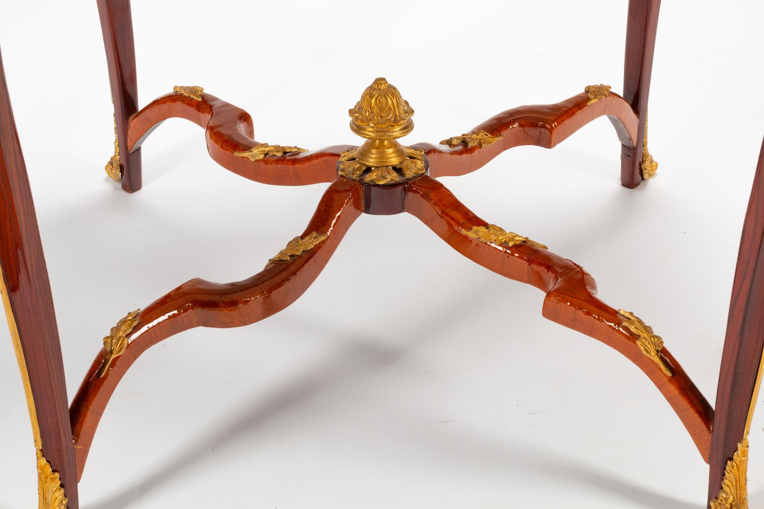 A Louis XV Style Gilt Bronze Mounted Parquetry Center Table with a Tiger's Eye Top