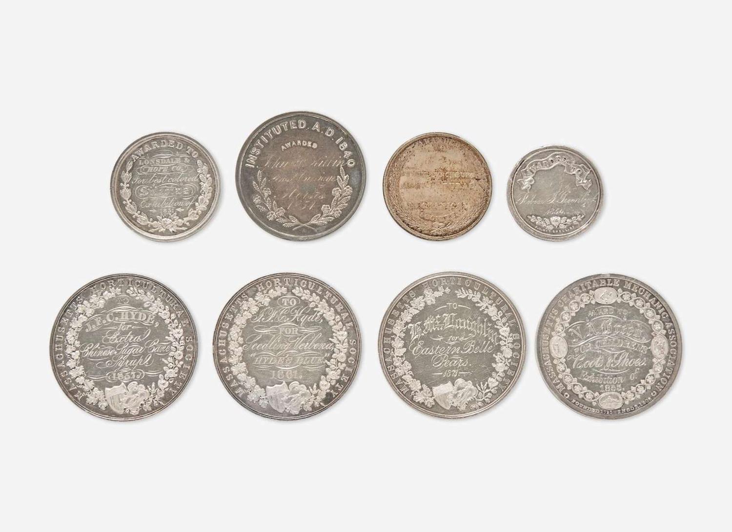 A collection of eight silver medals representing various societies, dates ranging 1851-1871